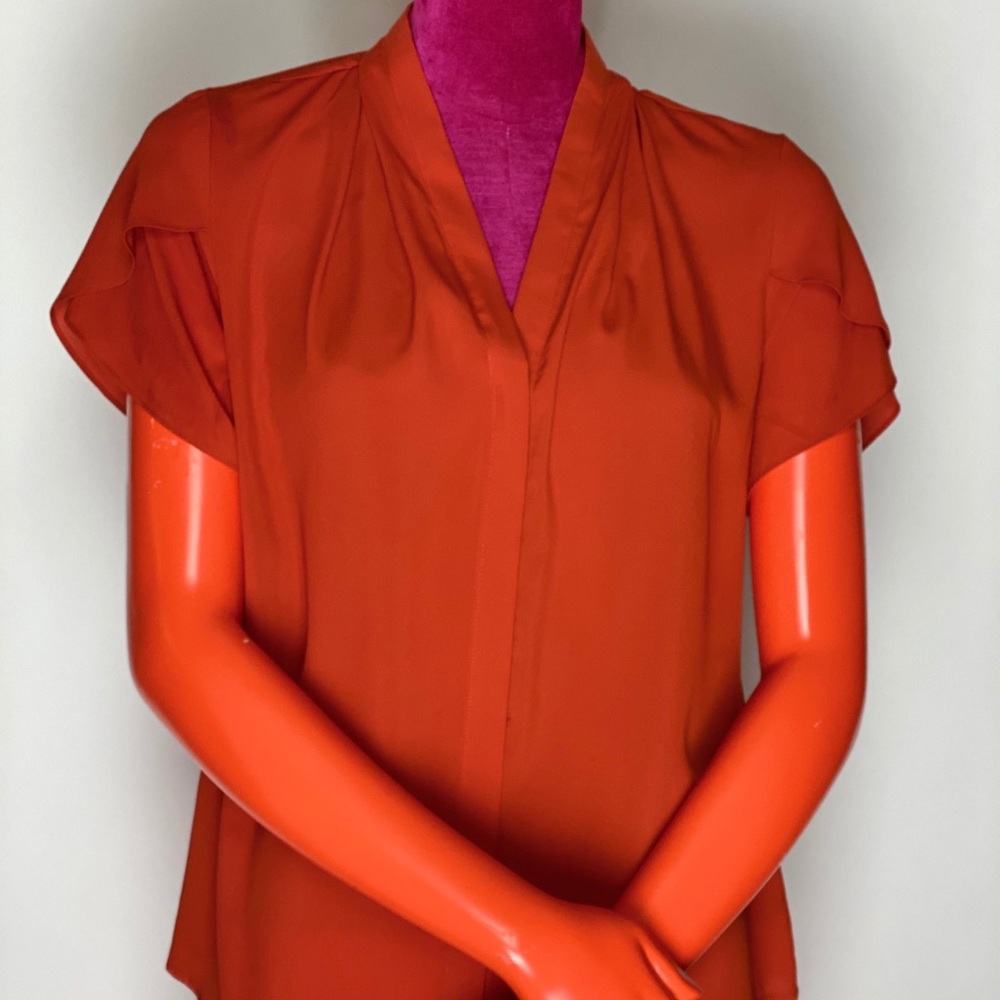 Solid tomato blouse.